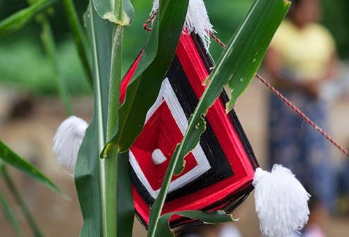 Huichol Indian God's eye yarn art.